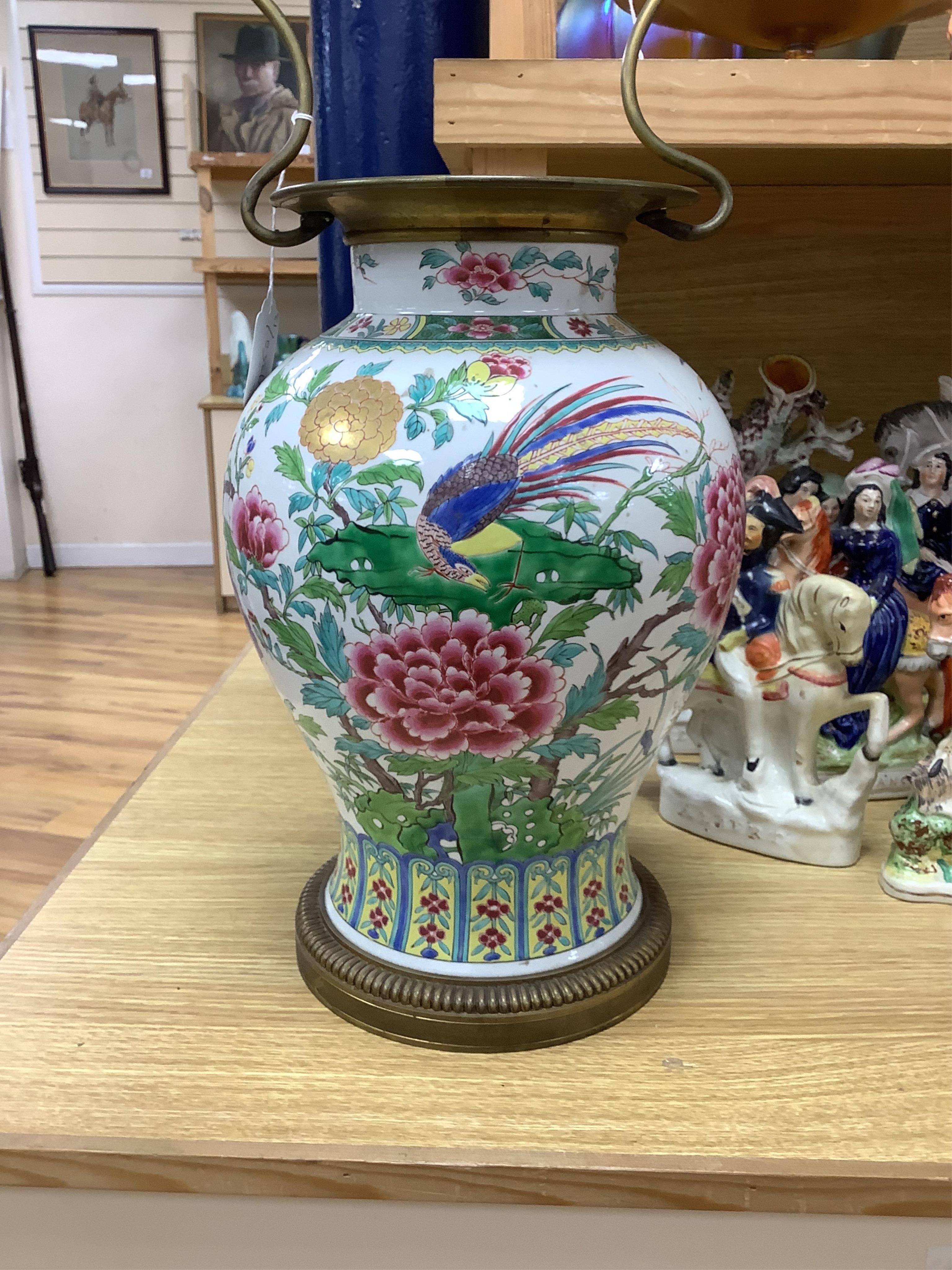 A Chinese famille vase and cover, converted to a two light lamp, 75cms high including fitting. Condition - fair to good